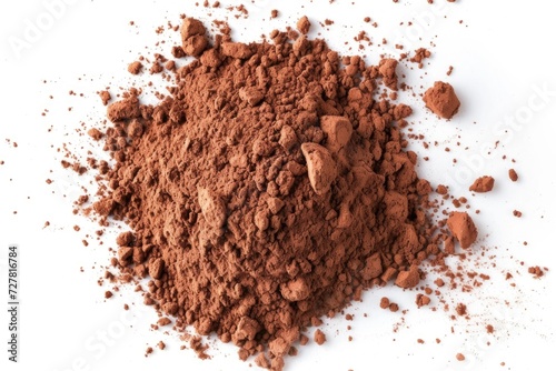 A pile of cocoa powder on a white surface. Perfect for food and beverage-related projects