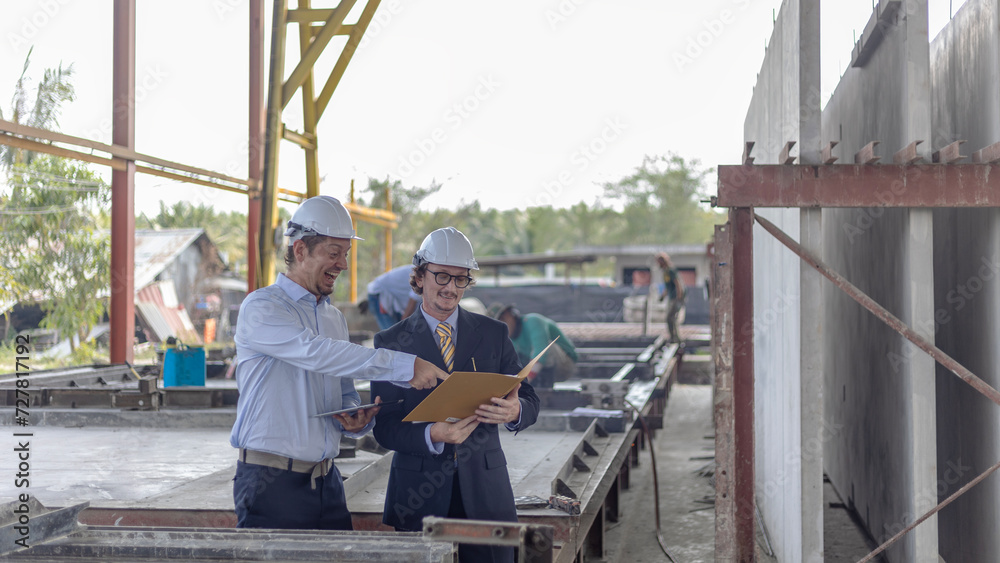 Factory owner discusses with his engineer to design for a new construction product. Supervisor provides technical advice to his manager in a factory