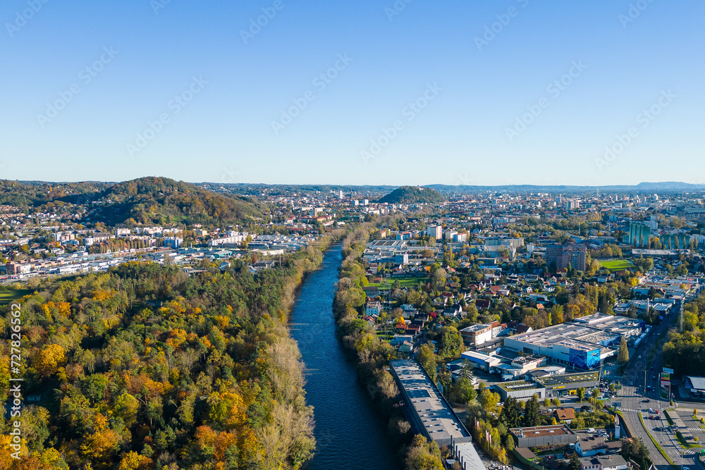 River Mur flowing through the city of Graz, Austria. Aerial city view