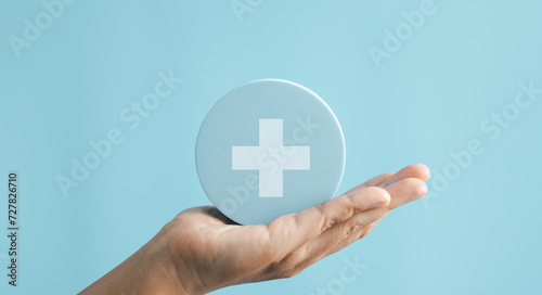 Health care, insurance concept. People hands holding plus and healthcare medical icon, health and access to welfare health. Medical care insurance, and Business healthy concepts. Copy space.