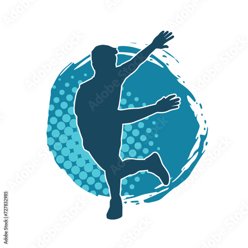Silhouette of a slim man dancing pose. Silhouette of a male dancer in action pose.