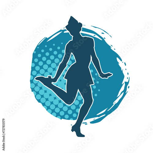 Silhouette of a female dancer in action pose. Silhouette of a woman dancing happily.