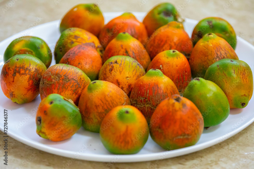 Rare and exotic fruit of the peach palm (Bactris gasipaes), typical fruit of the Brazilian tropical forests, Amazonas, Pará, Rondônia and Acre Rare and exotic fruit of the peach palm (Bactris gasipaes), typical fruit of the Brazilian tropical forests, Amazonas, Pará, Rondônia and Acre