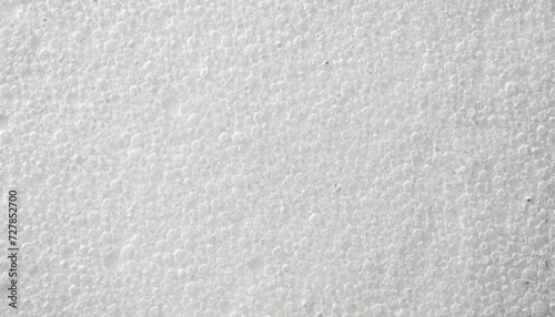 White foam plastic or styrofoam as texture or background, top view photo