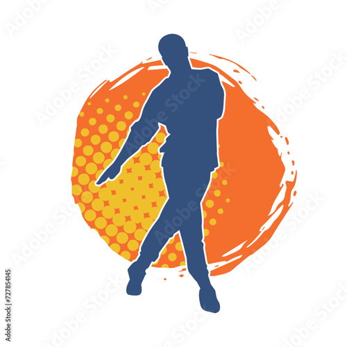 Silhouette of a slim man dancing pose. Silhouette of a male dancer in action pose.