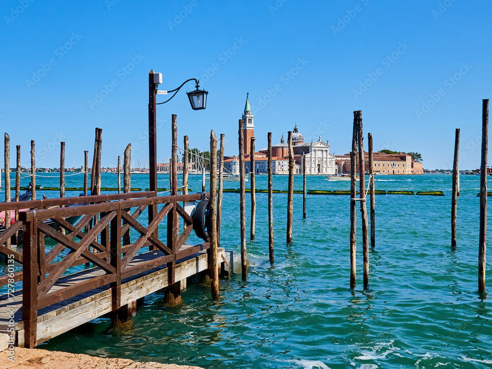 San Giorgio Maggiore Basilica and island seen from Riva degli Schiavoni promenade. Venetian Lagoon, Venice, Italy, Europe San Giorgio Maggiore Basilica and island seen from Riva degli Schiavoni promenade. Venetian Lagoon, Venice, Italy, Europe