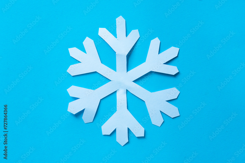 snowflake cut out paper on blue snowflake cut out paper on blue
