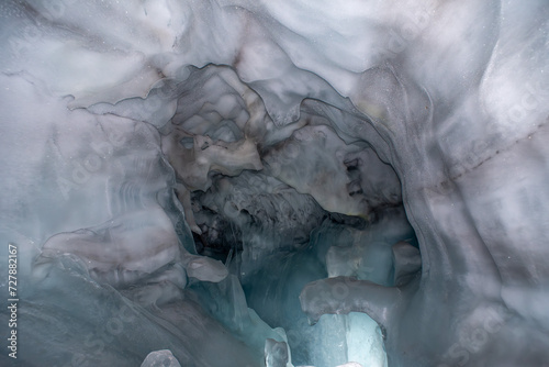 Great ice formation in a natural small glacial ice cave in Iceland