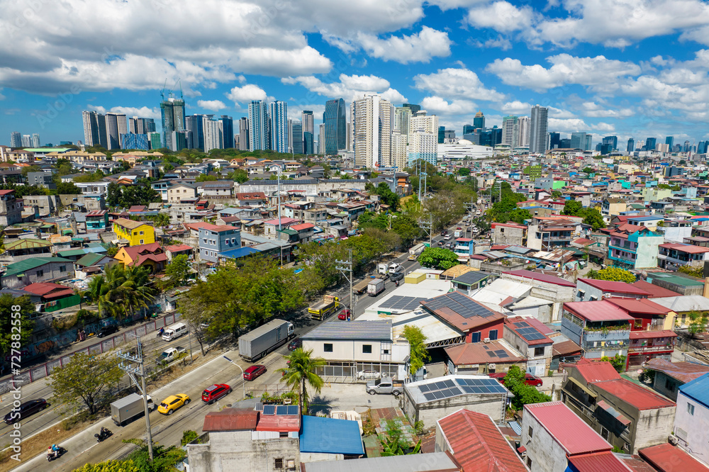 Taguig, Metro Manila, Philippines - Feb 03, 2024: Aerial of C5 road, old Taguig, Mckinley Village, and BGC business district.