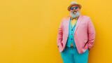 a hip older overweight man dressed in a modern pastel suit on a yellow background.