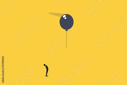 Businessman looking up fly balloon. loneliness concept