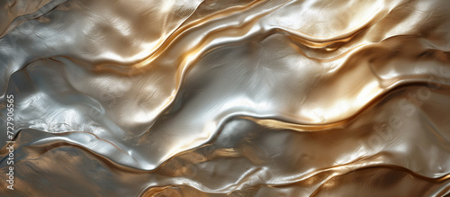 Waves of golden and silver color melted together with luxurious pearl shine finish. Background for beauty or accessories banner, mocha color