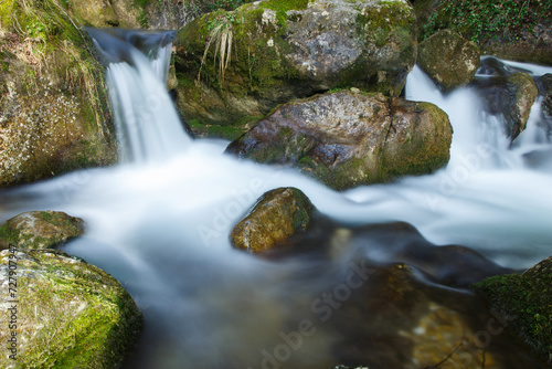 Waterfalls Flowing and Water Cascading over Rocks  in a Mountain Forest Lond Exposure photo