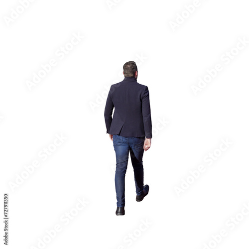 Homme vu de dos qui marche, il porte un costume sombre et un jean ainsi que des souliers photo