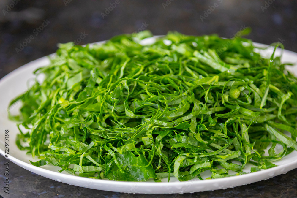 Kale leaves chopped and sliced into thin strips Kale leaves chopped and sliced into thin strips