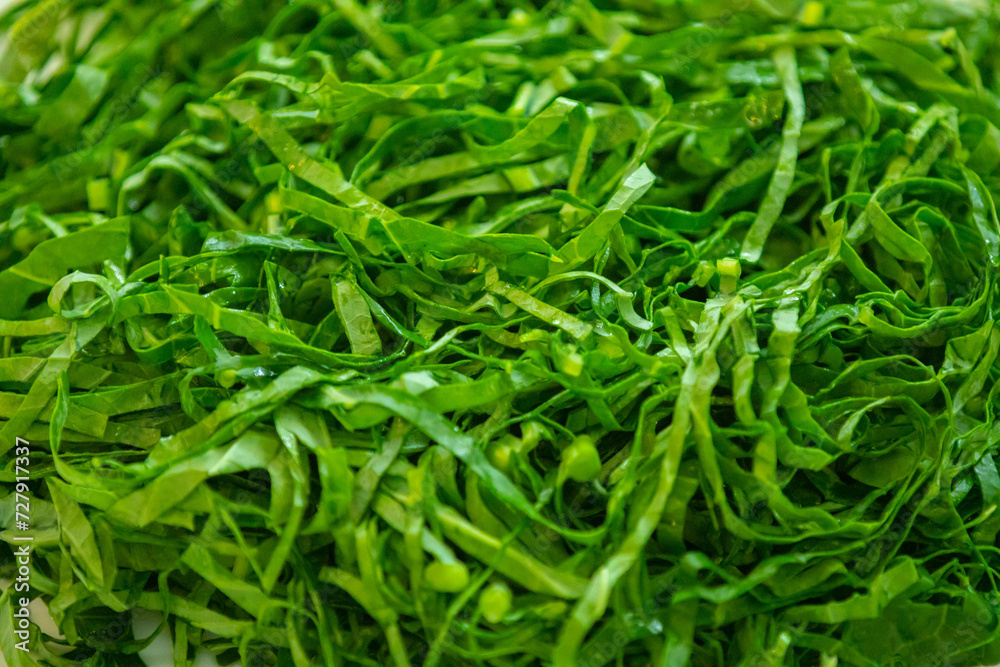 Kale leaves chopped and sliced into thin strips Kale leaves chopped and sliced into thin strips