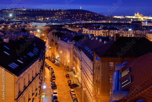 Rooftop view of street in historic district of Prague city at evening time