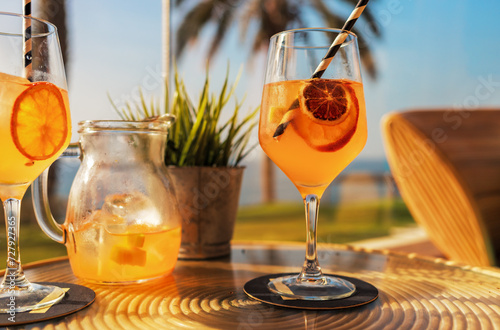 Fototapeta Naklejka Na Ścianę i Meble -  Sangria cocktail with white wine at the beach bar. Refreshing summer drink.