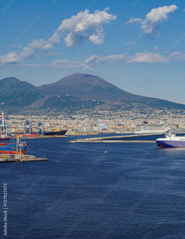 Mega modern cruise ship cruiseship liner Preziosa in port of Naples Napoli, Italy with Vesuv volcano panorama for Mediterranean summer cruising