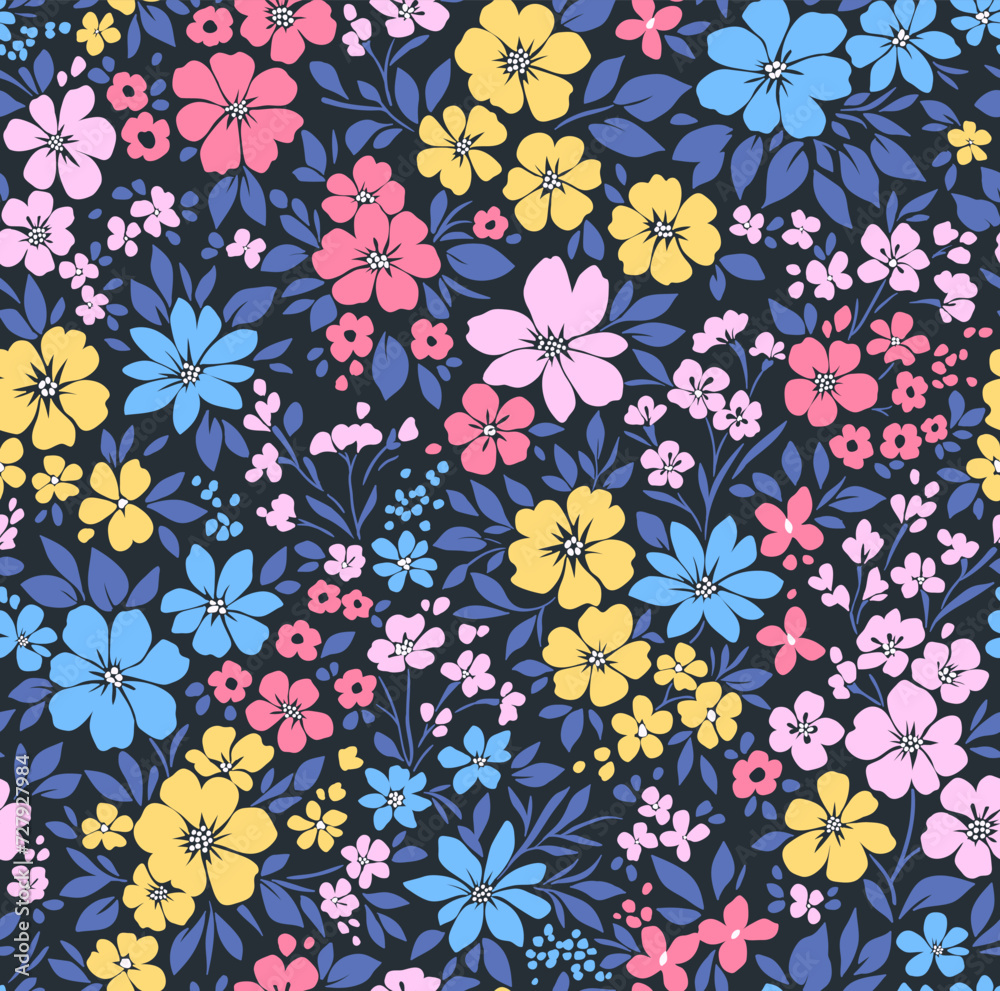 Beautiful floral pattern in small abstract flowers. Small blue, pink and yellow flowers. Blue background. Ditsy print. Floral seamless background. Liberty template for fashion prints. Stock pattern.