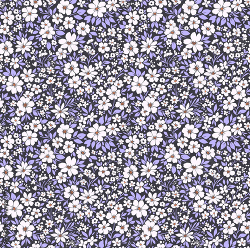 Ditsy floral pattern. Abstract flowers on blue background. Printing with small white flowers. Cute print. Seamless vector texture. Spring motif.