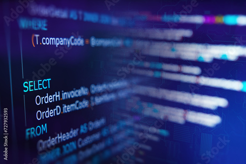 Developer or Programmer's text editor showing SQL (Structured Query Language) code on computer monitors. SQL Programming language concept, Computer courses, Training, Learning, Database Backup, DBMS.