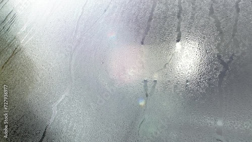 a condensation dew glass car water wet windshield window rain rainy mist moist vehicle drops moisture fog transparent light closeup video clean stream condensate climate humid drip motion closeup drop