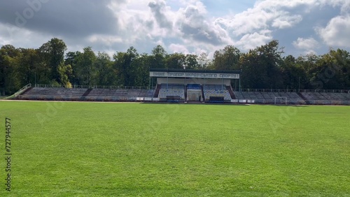 Small football stadium with green grass in daytime