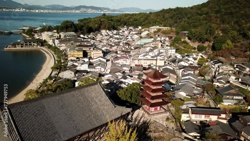 Miyajima Island near Hiroshima, Japan. Aerial view of an iconic Hiroshima torii gate in the sea and Itsukushima shrine. High quality 4k footage photo