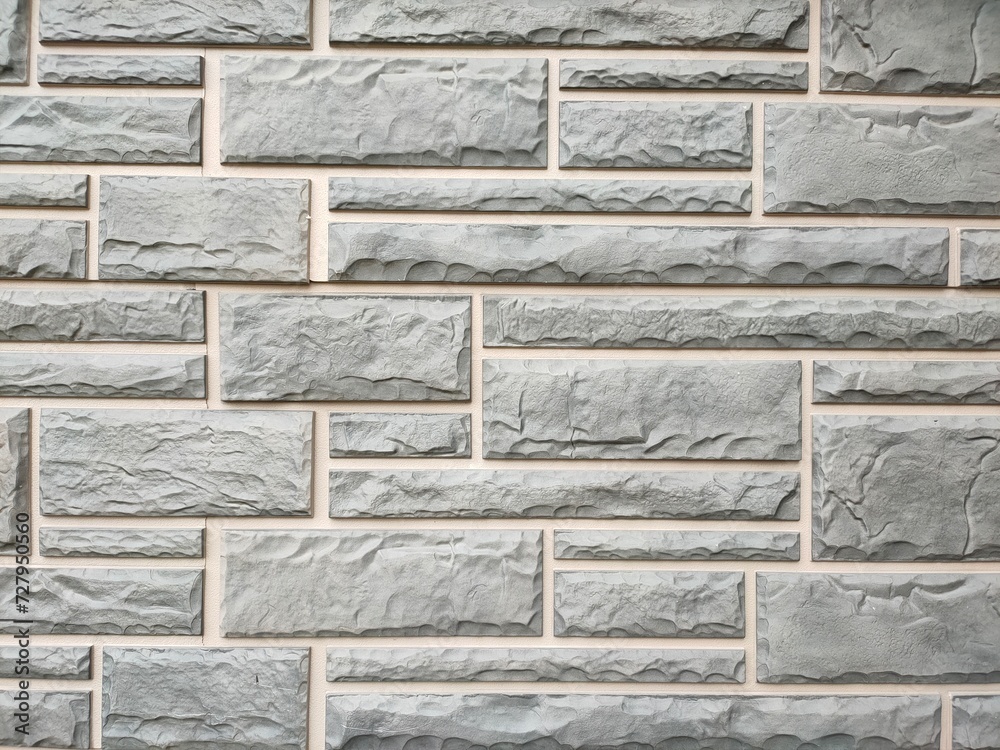 Grey stone tiles on the wall. Background. Texture. Grey stone tiles on the wall. Background. Texture.