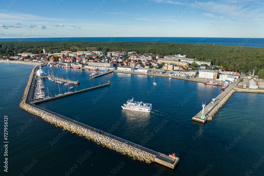 Naklejka premium Port hel peniinsula in Poland.. Aerial view of Hel Peninsula in Poland, Baltic Sea and Puck Bay . Hel city .Photo made by drone from above. Hel seaport