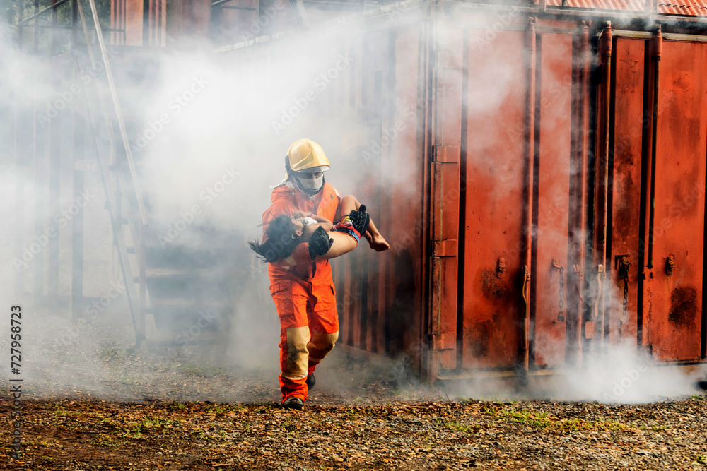 Firefighter to save girl in fire and smoke. Rescue Team or Firefighters save lives people from fire. Firefighter or Emergency team rescue saving life people from fire. Firefighter to save girl in fire and smoke. Rescue Team or Firefighters save lives people from fire. Firefighter or Emergency team rescue saving life people from fire.