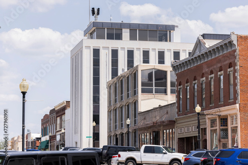 Independence, Missouri, USA - June 16, 2023: Afternoon sunlight shines on the historic core of downtown Independence.
