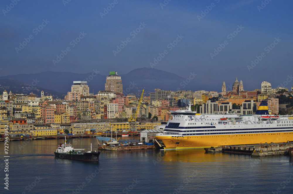 Passenger pax roro ferry in port of Genoa, Italy on sunny day with city skyline	