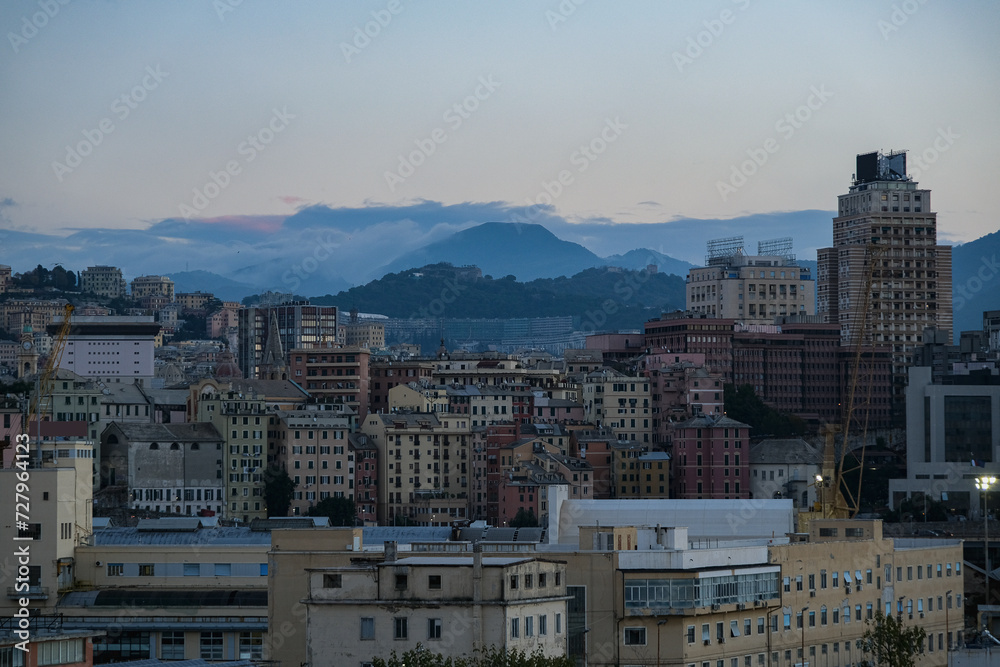 Fototapeta premium Romantic backstreet, side street or alley in historic old town of Genoa, Italy with historic Mediterranean style architecture facades, a landmark sightseeing tourist spot in downtown