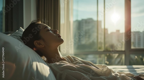 Simple lifestyle, Asian woman wakes up from good sleep on weekend morning, takes some rest, relax in comfortable bedroom at hotel window, happy lazy day, comfortable, dreaming