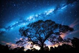 A stunning photograph capturing the beauty of a tree against a sky filled with sparkling stars, The Milky Way galaxy stretching across a night sky, AI Generated