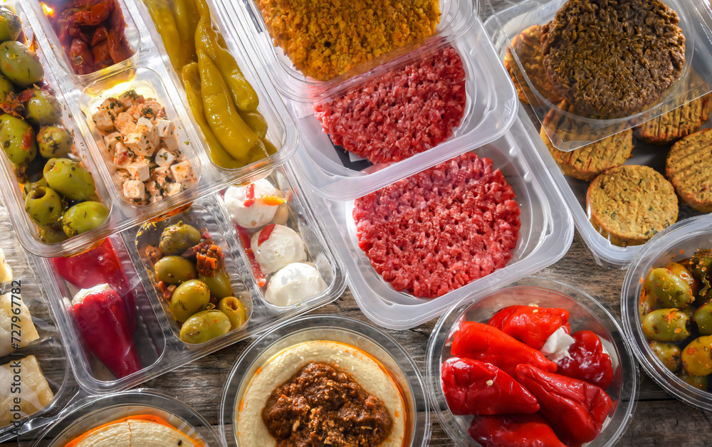 Variety of prepackaged food products in plastic boxes Variety of prepackaged food products in plastic boxes
