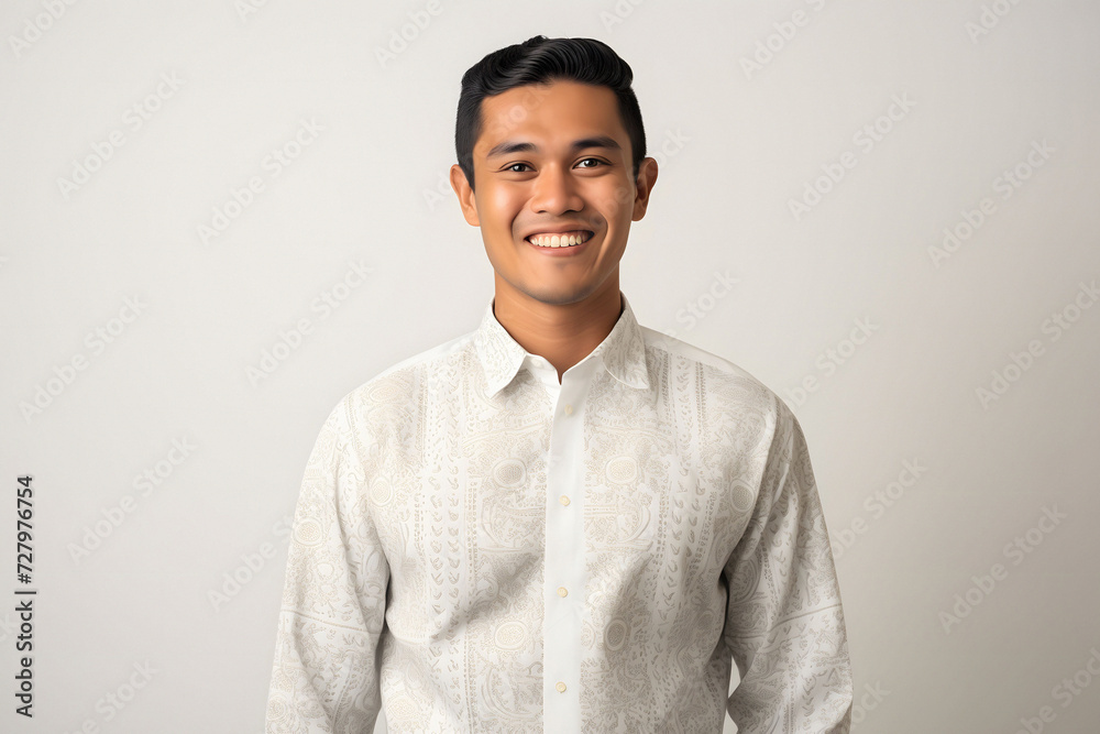 Youthful Muslim man standing on a white background, adorned with traditional Balinese motifs in a happycore style, captured with the vibrant energy of Provia film Youthful Muslim man standing on a white background, adorned with traditional Balinese motifs in a happycore style, captured with the vibrant energy of Provia film