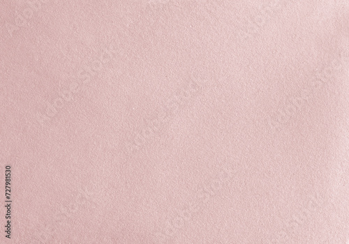 Grunge Background with Light Pink Fine Sand. Delicate Grainy Layout. Abstract Pink Sandy Layout. Sand Structure. No text. Rose Gold Grungy Texture.