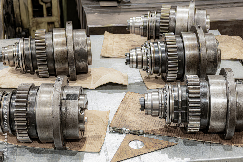 Disassembled spindles of cnc machines for repair in a metalworking equipment repair workshop. Disassembled spindles of cnc machines for repair in a metalworking equipment repair workshop.