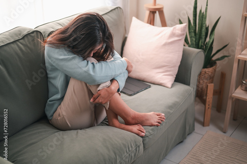 sad, depression, unhappy, depressed, lonely, problem, upset, alone, sofa, bad. depressed young woman sitting on couch in home, frustrated confused female feels unhappy problem in personal life.
