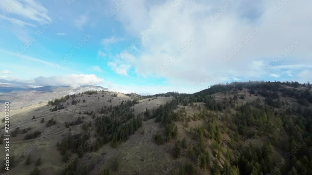 FPV drone high speed flying above the trees at Green Mountain road, British Columbia, Canada. High quality 4k footage FPV drone high speed flying above the trees at Green Mountain road, British Columbia, Canada. High quality 4k footage