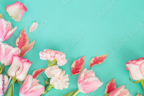 beautiful pink spring flowers on blue background