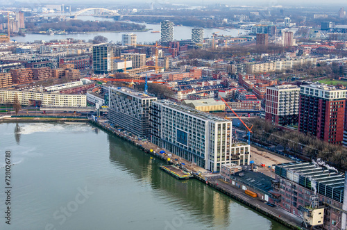 Rotterdam, The Netherlands, January 29, 2024: aerial view over Rijnhaven harbour and the neighbourhood of Katendrecht, with the river Nieuwe Maas in the distance