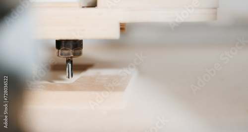 Close-up cutting wood on CNC milling machine for kitchen furniture wooden on factory