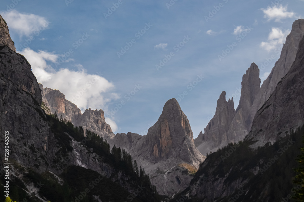 Scenic view of majestic mountain peak Zwoelferkofel (Croda dei Toni) seen from panoramic valley Fischleintal near Moos. Rugged ridges of wild Sexten Dolomites in Italian Alps. Wanderlust in wilderness