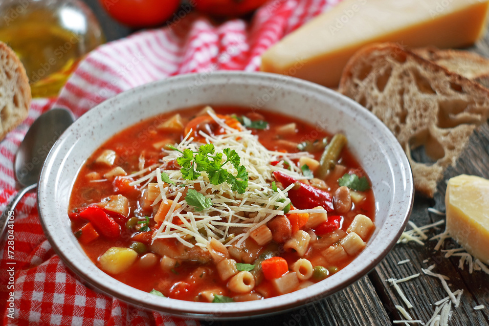 Minestrone soup with pasta and vegetables. Italian food. Selective focus.
Minestrone soup with pasta and vegetables. Italian food. Selective focus.