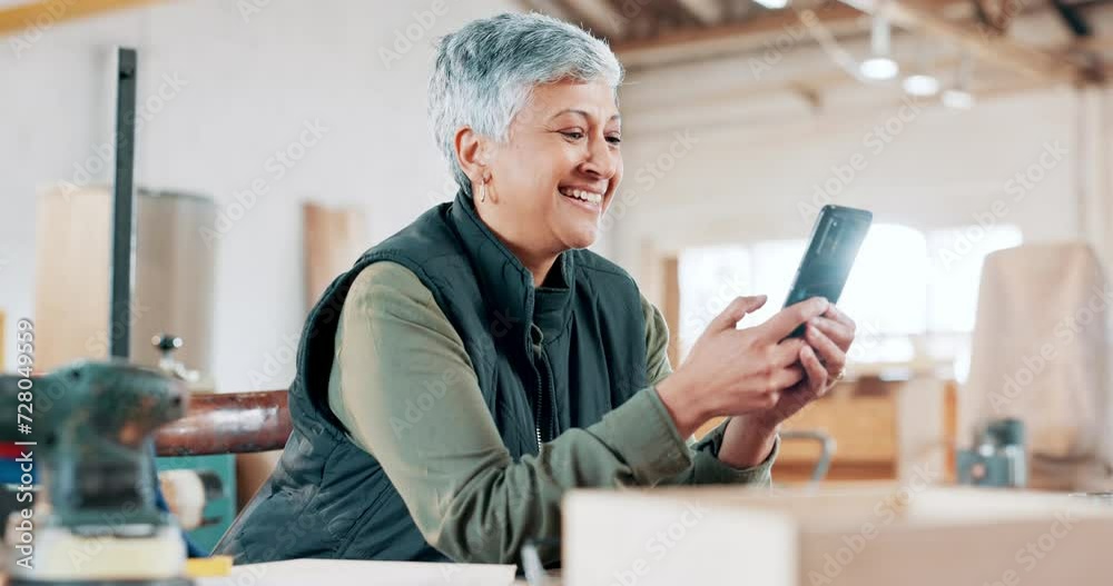 Phone, smile and mature woman in workshop networking on social media, mobile app or internet. Happy, technology and senior female carpenter typing online email or message on cellphone in warehouse. Phone, smile and mature woman in workshop networking on social media, mobile app or internet. Happy, technology and senior female carpenter typing online email or message on cellphone in warehouse.