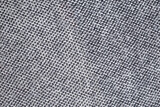 Soft gray blanket texture with lines and dots, abstract texture close up